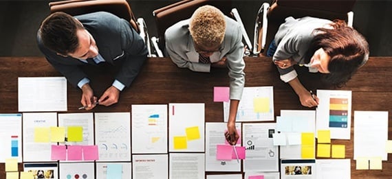 3 team members of not-for-profit planning out funding