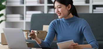 Business owner on her laptop checking out her CPA's website