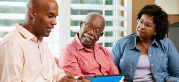 CPA having a thoughtful conversation with an older couple
