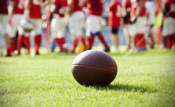 Football alone on field