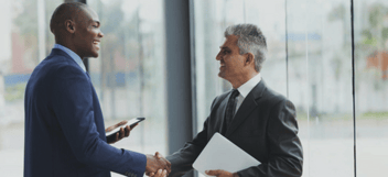 A CPA and a client shaking hands after a meeting