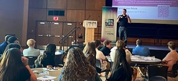 CPA presenting an accounting careers presentation in front of a large group of students