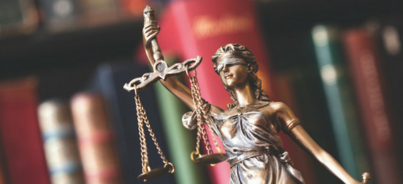 close up of statue of lady justice and her scales