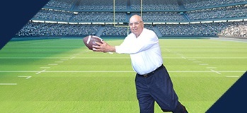 Photo of author catching football: A student athlete would require NIL payments